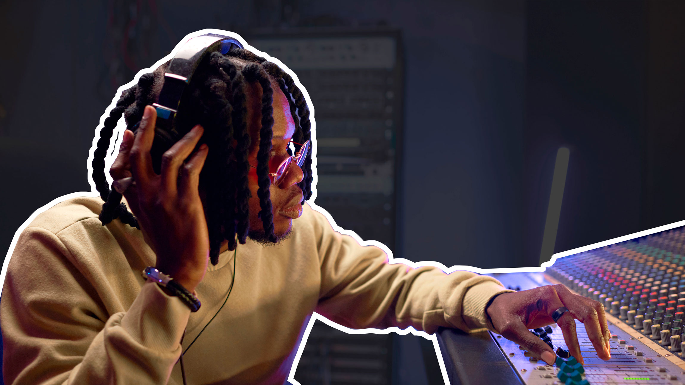 Musician composing song on audio equipment